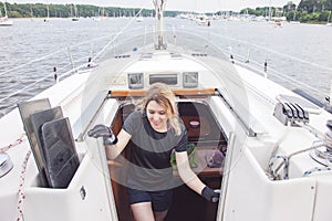 Woman walking up stairs from Cabin on sailboat