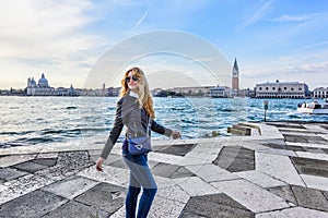 Woman walking in Venice Italy. Traveler or tourist girl exploring the city