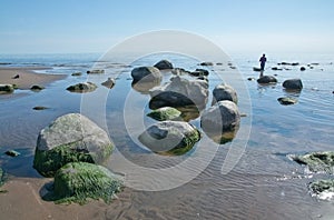 Woman walking into the water