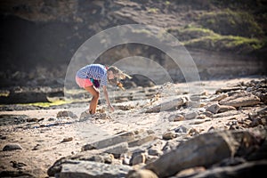 Woman Walks Alone on a Deserted Beach