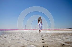 Woman walks alone on a deserted beach, solitude, serene, lonely concept. carefree vacation in nature