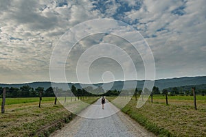 Woman Walks Down Hyatt Lane