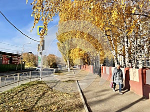 Ufa, Republic of Bashkortostan, Russia, October 17, 2021: Woman walks down Mendeleev Street in Ufa in autumn. Republic of Bashkort