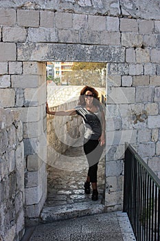 Woman Walks Dubrovnik's Walls