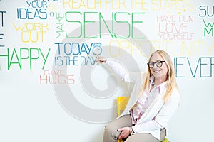 Woman on the wall background with various inscriptions