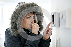 Woman With Warm Clothing Feeling The Cold Inside House