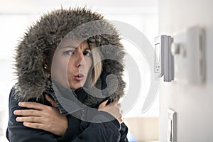 Woman With Warm Clothing Feeling The Cold Inside House