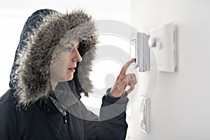 Woman With Warm Clothing Feeling The Cold Inside House