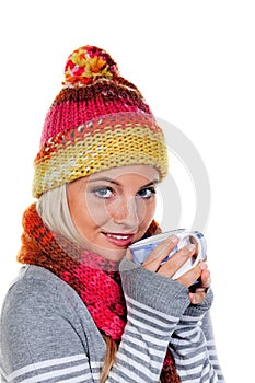 Woman with a warm hood with hot tea