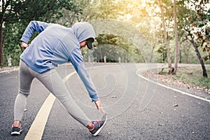 Woman warm up before running on the road for health concept