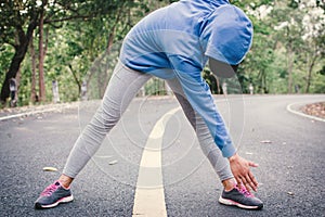 Woman warm up before running on the road for health concept