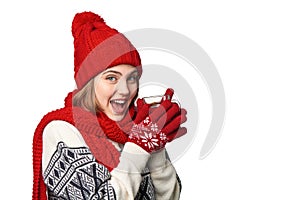 Woman in warm winter clothing with cup of tea