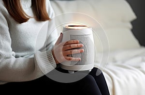 Woman warming hands near heater. Generate Ai