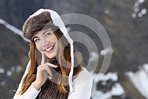 Woman warmly clothed thinking in winter photo