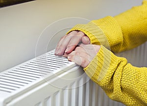 woman warms her hands