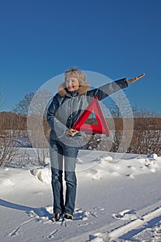 Woman with a warning triangle