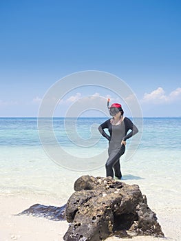 Woman warring snorkler on summer vacation