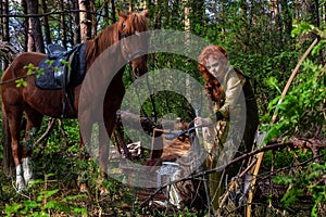 Woman warrior armed with a bow on horseback