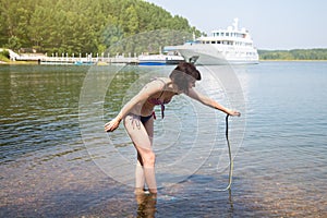 The woman was terribly scared of a water snake holds