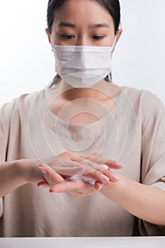 Woman wash hands on white background