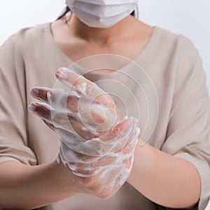 Woman wash hands on white background