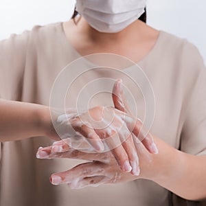 Woman wash hands on white background