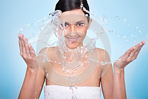 Woman wash her face with water