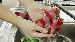 Woman washin vegetables