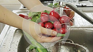 Woman washin vegetables