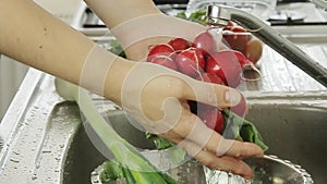 Woman washin vegetables