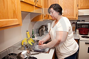 Woman washing dishes