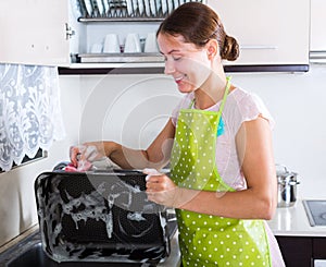 Woman washing dishes