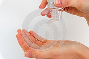Woman washing hands with hand sanitizer alcohol antibacterial to prevent germs, bacteria and avoid coronavirus