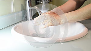 Woman washing hands under the water tap. Hygiene concept