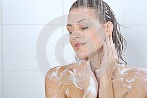 Woman washing her body shower gel