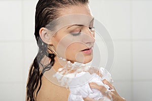 Woman washing her body shower gel