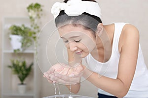 Woman washing her face