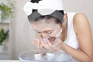 Woman washing her face