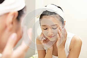 Woman washing her face