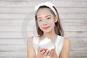 Woman washing her face