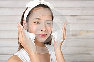 Woman washing her face