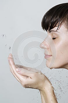 Woman washing her face