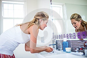 Woman washing her face