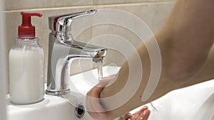 Woman washing her hands to protect coronavirus pandemic