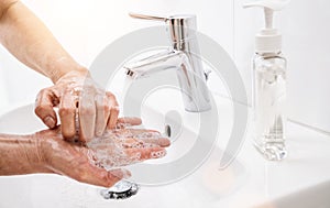 Woman washing his Hands to prevent virus infection and clean dirty hands - coronavirus Sars-CoV-2 covid-19 concept image