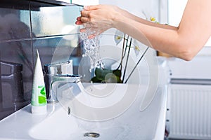 Woman washing up in the morning