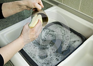Woman washing up mug
