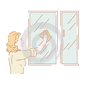 Woman washing windows or wiping glass housework