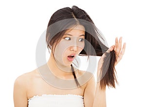 Woman watching the damage hair and splitting ends