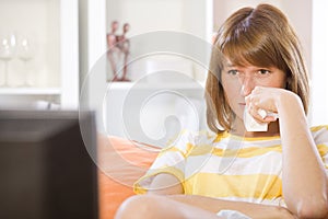 Woman watching drama on television